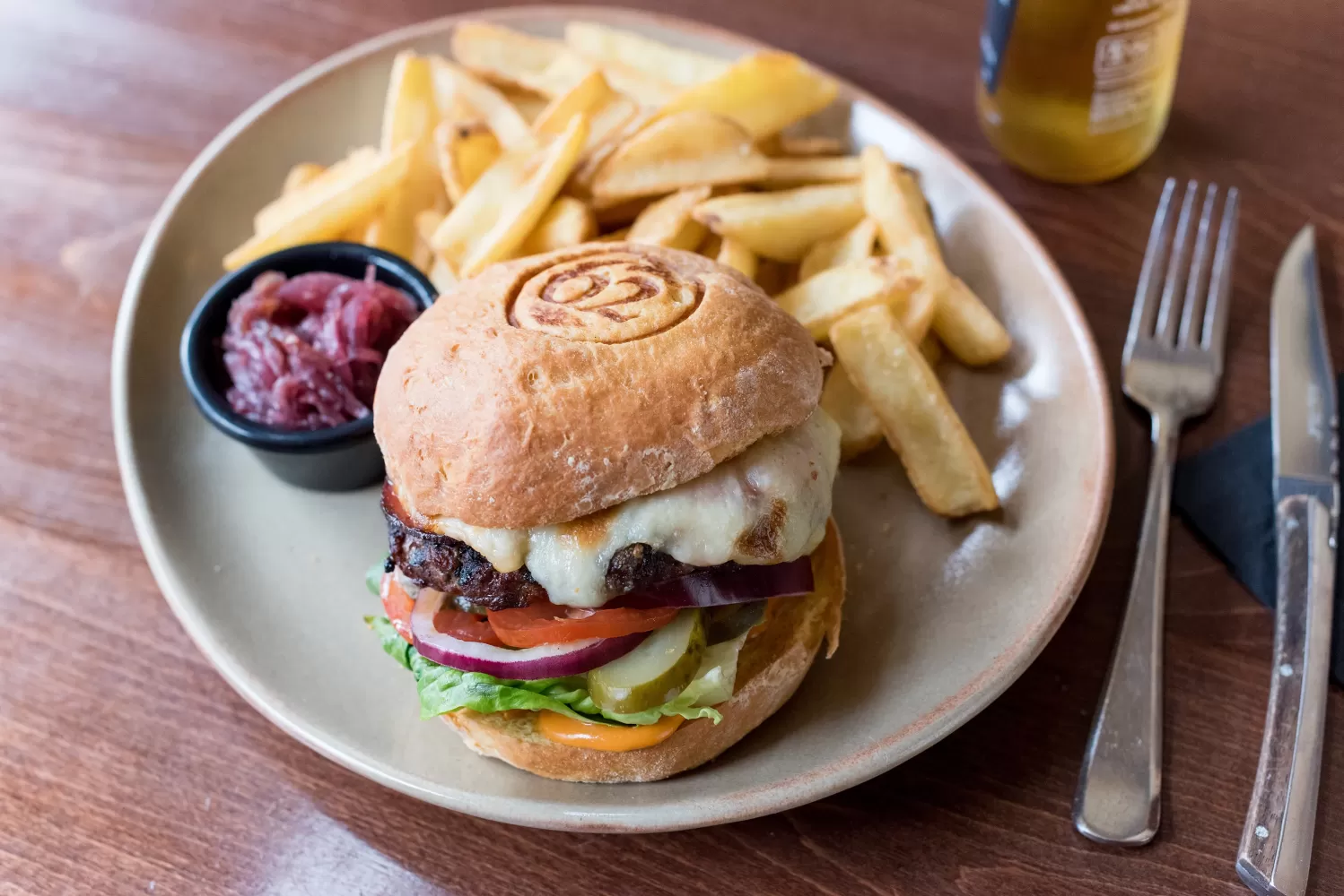 A delicious hamburger served with hand cut chips at Barnstaple Restaurant 62 The Bank