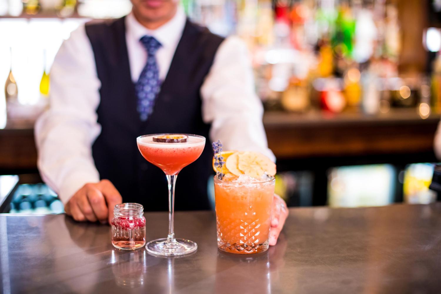 A mixologist preparing cocktails at Barnstaple cocktail bar and lounge bar 62